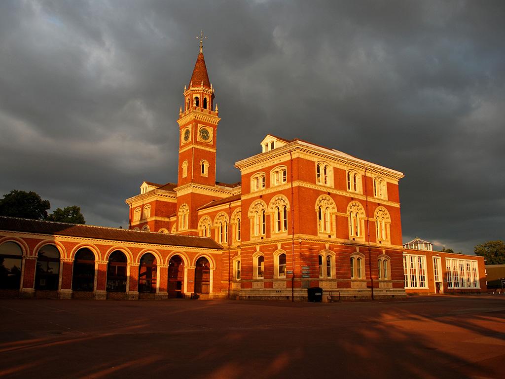 A Victorian independent school building at dusk